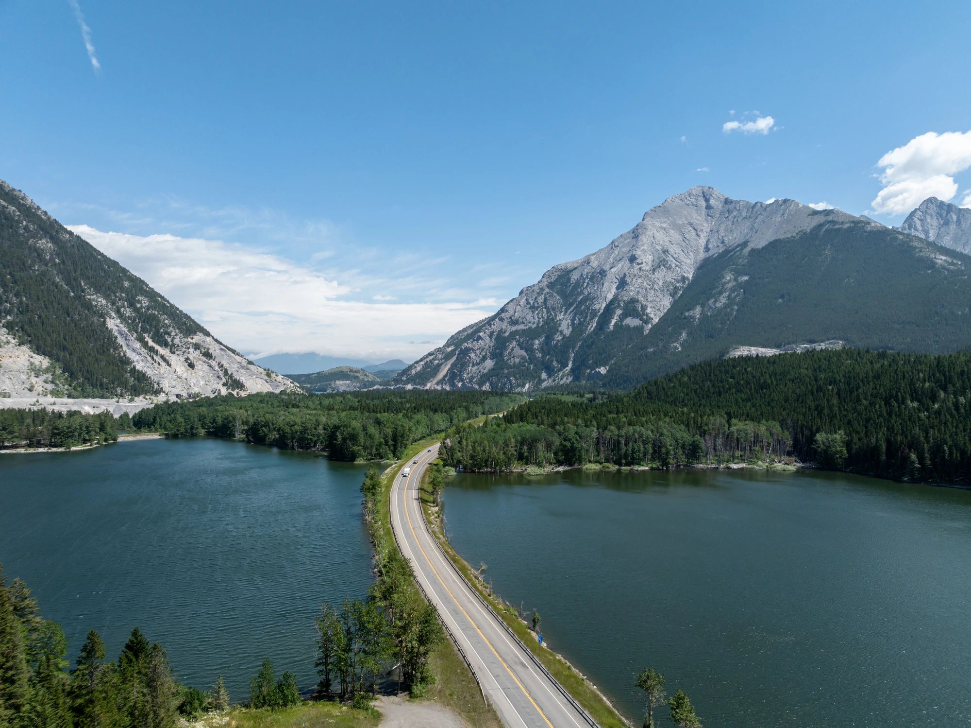 Open road through mountains representing nationwide coverage